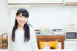 © taka - young asian women relaxing in the kitchen