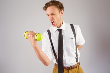 Poster - Geeky businessman lifting a dumbbell