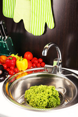 Wall Mural - Fresh vegetables in sink in kitchen