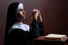 Young Attractive Nun Praying