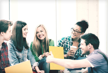 Poster - students communicating and laughing at school