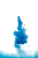 Ink swirling in water, cloud of ink in water isolated on white.