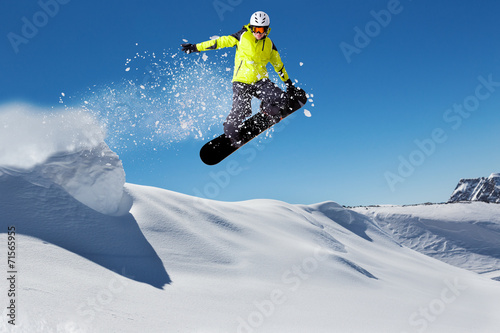 Fotografie, Obraz Free rider on snowboard jumping from hill