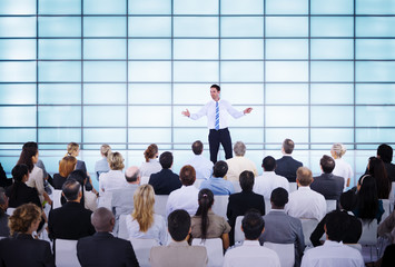 businessman giving presentation to his colleagues