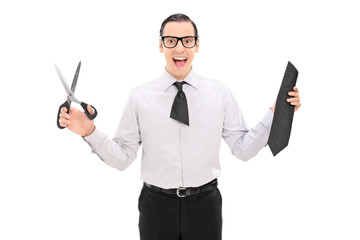 Canvas Print - Overjoyed man with a cut tie holding scissors