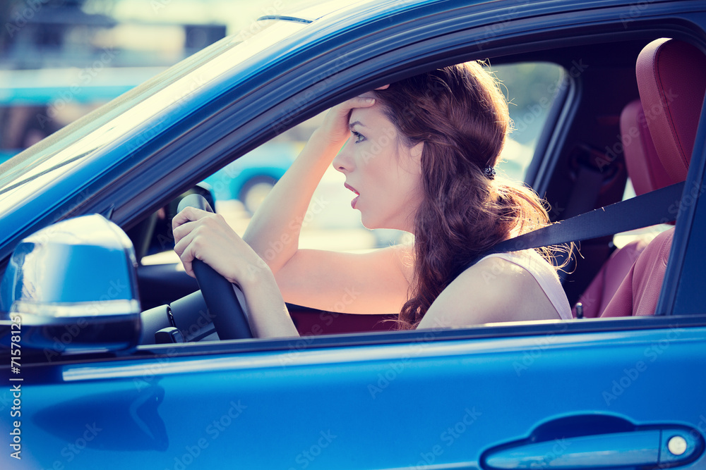 displeased stressed female car driver driving in heavy traffic Stock ...