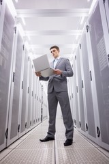 Poster - Concentrated technician in suit standing