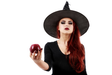 Tricky witch offering a poisoned apple, Halloween theme