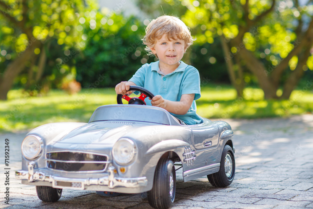 little boy driving