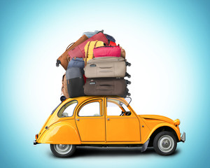 Wall Mural - Retro car with Luggage on the roof, tourism