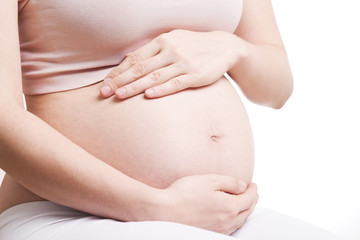 Pregnant Woman Belly. Pregnancy Concept. Isolated on a White Bac