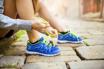 Woman running in city closeup