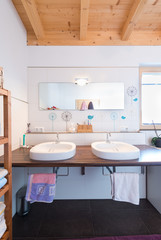 modern new bath room with two basins in timber house