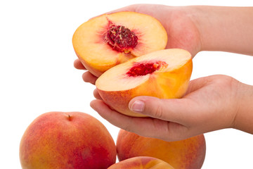 Child with Halves of ripe peach