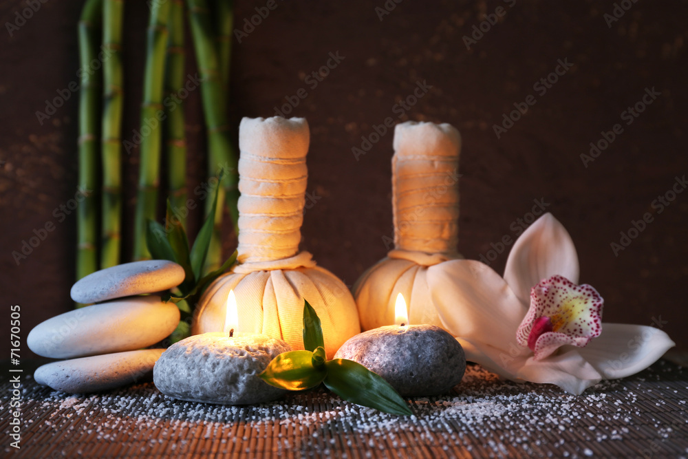 Spa set on bamboo mat on dark background