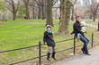 © travnikovstudio - Young father and little daughters in Central Park