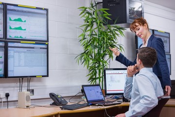 Poster - Focused colleagues analyzing result on their computer