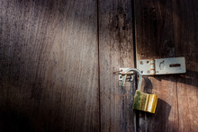Brass Lock On Wooden Door