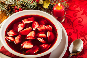 Wall Mural - Christmas red borscht with meat filled dumplings