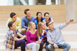 © Syda Productions - group of students with smartphone and coffee cup