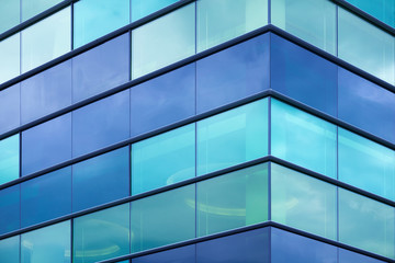 modern office facade fragment with blue green glass