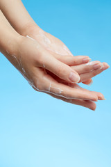 Wall Mural - Woman's hands in moisturizer cream