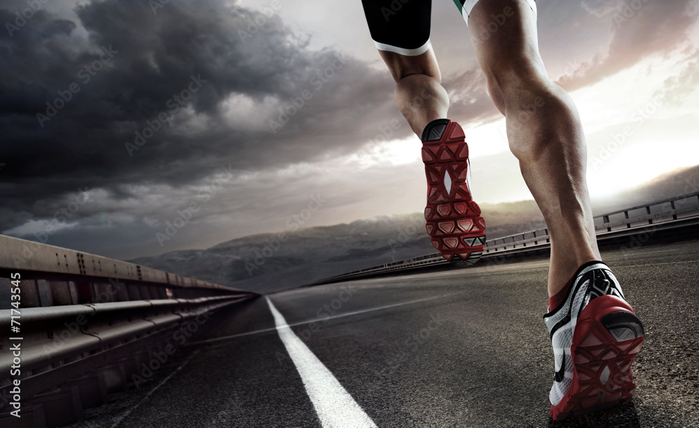 Sports background. Runner feet running on road closeup on shoe. - obrazy, fototapety, plakaty 