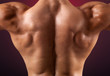 © cristovao31 - Close up of muscular back on dark background