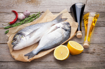 Fresh dorado fish cooking with spices and condiments