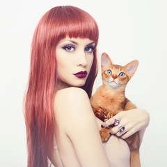 Beautiful lady with Abyssinian cat