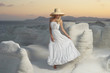 Lady in hat in an unusual landscape