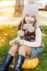 adorable little girl is wearing winter clothes