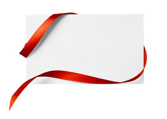 red silk ribbon on empty paper card