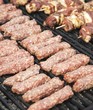 © George Serban - Minced meat rolls on grill