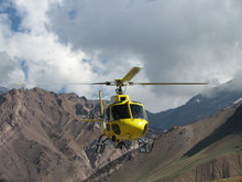 Yellow Rescue Helicopter In The Mountains