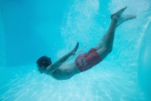 Young Man Swimming Underwater