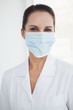 © WavebreakmediaMicro - Doctor wearing a surgical mask