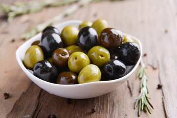 Different marinated olives on table close-up