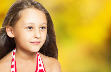 Wall Mural - Autumn portrait of a positive young girl