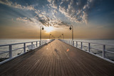 Fototapeta Dmuchawce - Sunrise on the pier at the seaside, Gdynia Orlowo, 