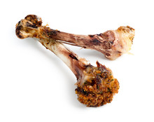 Closeup Of Cooked Chicken Bones Isolated Against White