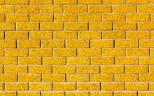 Energetic Yellow Brick Wall As A Background Image With Black Vig