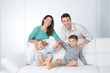 © Dave_Pot - cheerful family on white sofa
