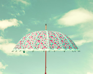 Poster - Vintage colorful umbrella and sky with clouds