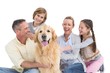 © WavebreakmediaMicro - Portrait of smiling family sitting together with their dog