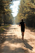 © Piotr Tomicki - Barefoot runner running through autumn forest
