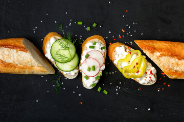 Wall Mural - Canapes with cottage cheese  on a black background