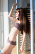 © Sergii Figurnyi - Fashion art photo of young sensual lady at the window