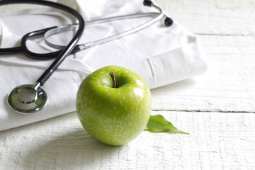 Alternative medicine apple and stethoscope concept