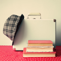 Wall Mural - Vintage Briefcase with hat and books